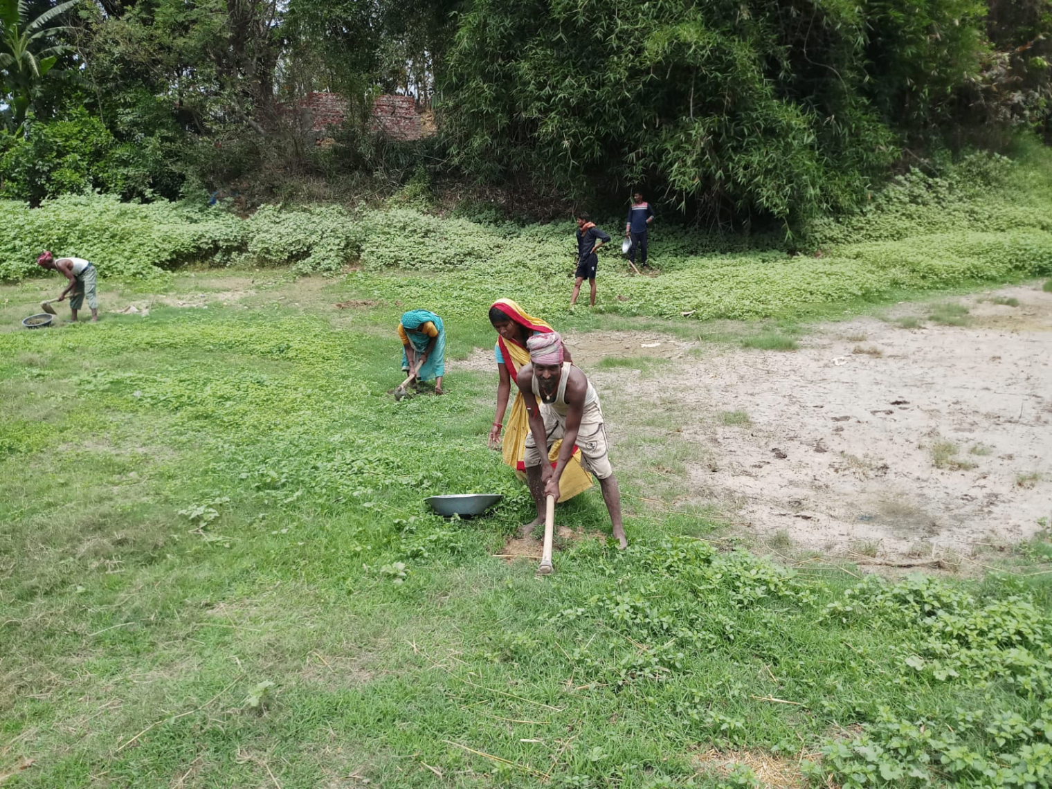 Grassroots fieldwork with villagers working together on land restoration